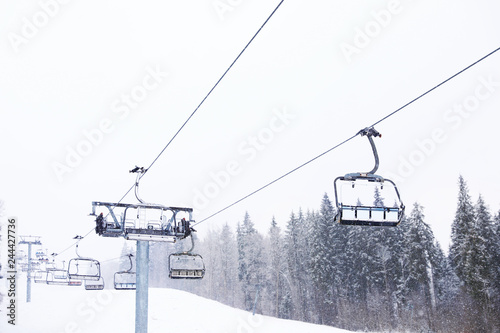 Ski lift at snowy mountain resort. Winter vacation