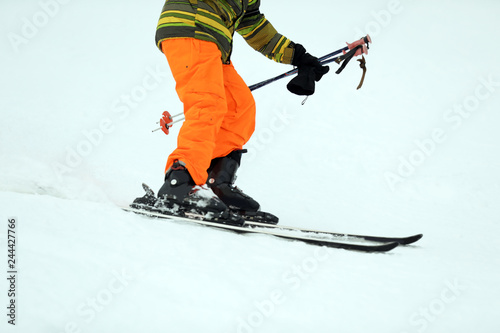 Skier on slope at resort, closeup. Winter vacation