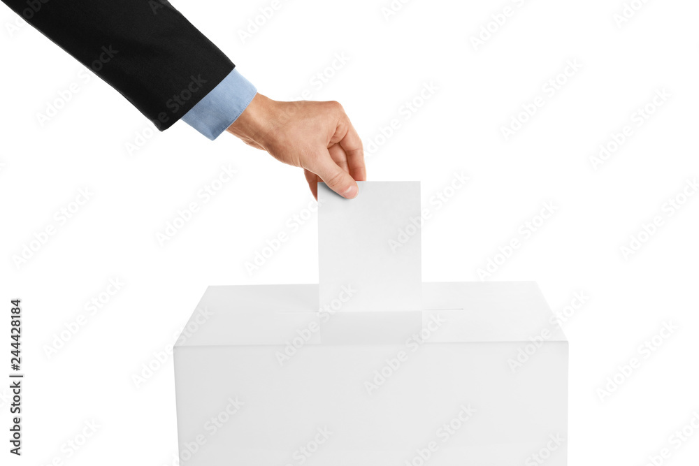 Man putting his vote into ballot box on white background, closeup Man putting his vote into ballot box on white background, closeup