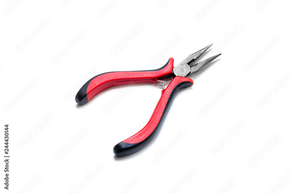 Red pliers on a white background. View from above Red pliers on a white background. View from above