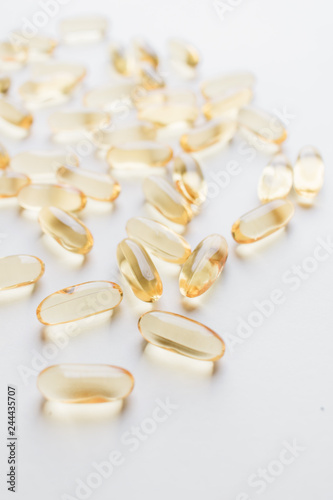 Cod-liver oil, Codliver oil, Marine oil, Yellow, White, Objects, Background, Oil, Health, Healthy, Medicine, Medical, Care, Procedure, Cosmetic, Skincare, Therapy, Treatment, Many, Pile, Medication, C