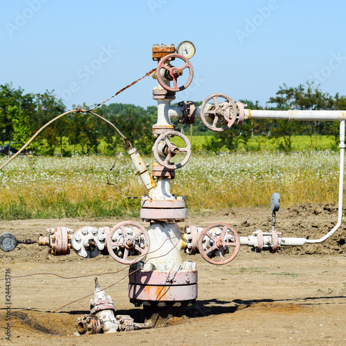 Well for oil and gas production. Oil well wellhead equipment. Oi photo