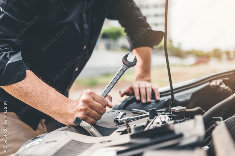 Auto mechanic working in garage Technician Hands of car mechanic working in auto repair Service and Maintenance car check. Auto mechanic working in garage Technician Hands of car mechanic working in auto repair Service and Maintenance car check.