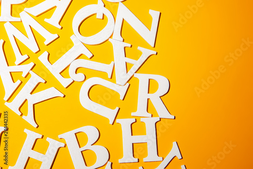 Reading. Letters Volumetric alphabet. Letters on a yellow background.