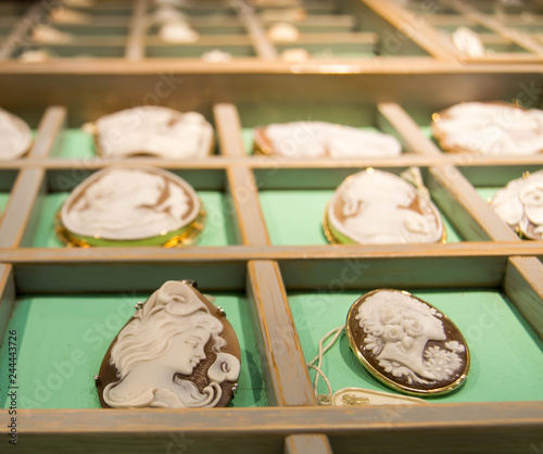 Принти на полотні Multiple cameo pendants on display