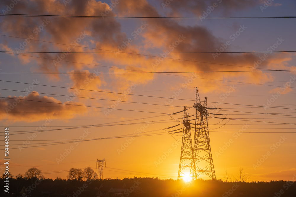Fototapeta premium high-voltage power lines at sunset. electricity distribution station