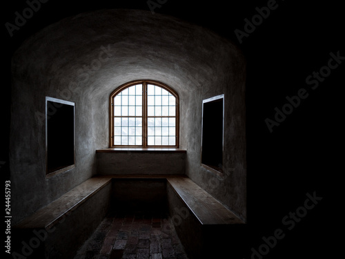 Medieval castle window. Turku castle is a 13th century stone castle located in Finland. Natural light in the morning through the glass indoors.