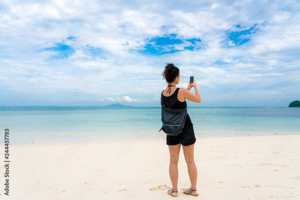 Woman on Beautiful Tropical Beach PP Island, Krabi, Phuket, Thailand blue ocean background girl items vacation accessories for holiday or long weekend a guide choice idea for planning travel Woman on Beautiful Tropical Beach PP Island, Krabi, Phuket, Thailand blue ocean background girl items vacation accessories for holiday or long weekend a guide choice idea for planning travel