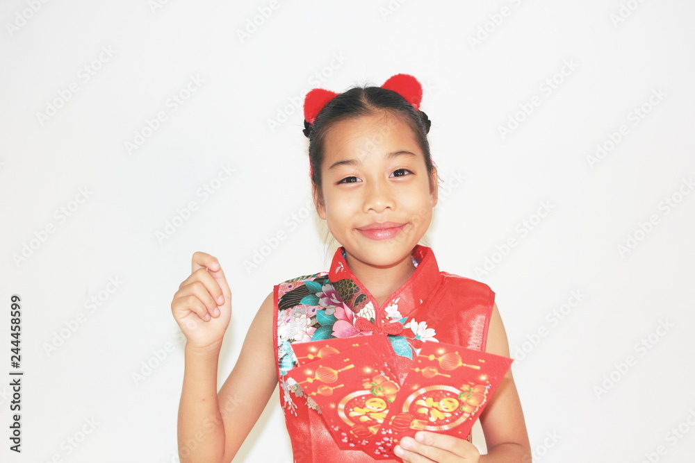 Asian Chinese child happy showing red paper packet gift on isolated white background ,Chinese new year concept. 