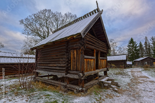 Photography Traditional wooden barn made of resin-impregnated logs in Skansen open-air Museum