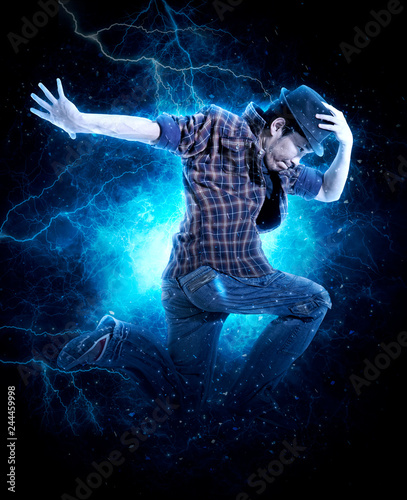 Man break dancing on electricity light background