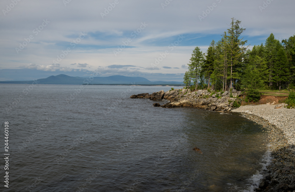 The shore of Lake Baikal in cloudy weather