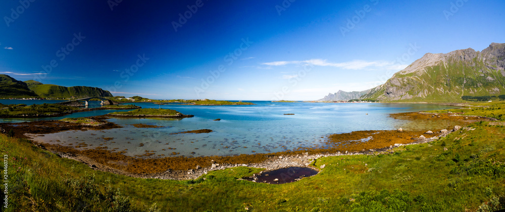 Fototapeta premium Landscape panoramic view to Fredvang bridge, Torvoya and buoya islands and Hovdanvika bay, Lofoten, Norway