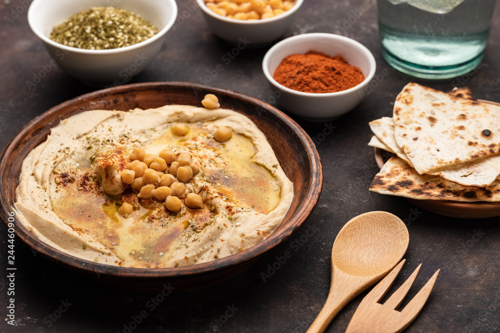 Classic Hummus with chickpeas, paprika, olive oil and oriental spices. Mediterranean popular snack of chickpeas and tahini pasta. Classic Hummus with chickpeas, paprika, olive oil and oriental spices. Mediterranean popular snack of chickpeas and tahini pasta.