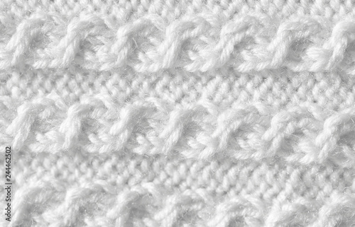 The background is white. The texture of the knitted fabric is made of woolen threads handmade.
