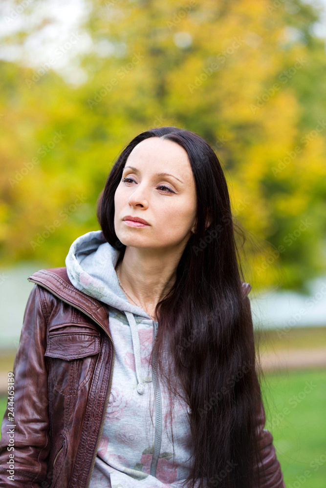 Young attractive woman in an autumn landscape Young attractive woman in an autumn landscape