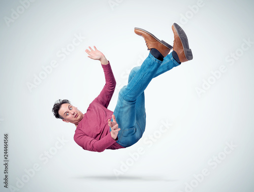 Situation, the man in casual clothes is falling. Concept of an accident photo