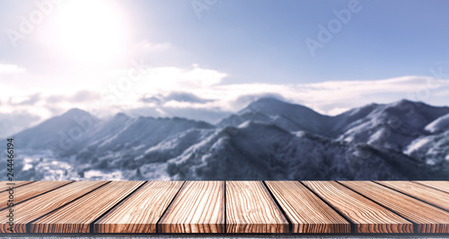 Empty Wooden board top table in front of blurred snow mountain view  background. Perspective wood in blurred winter landscape background for  photo montage, product display or mock up your product. Stock Photo |