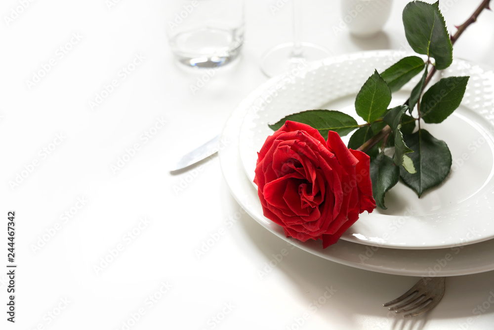 Valentine's day or birthday romantic dinner. Romantic table setting with red rose. Valentine's day or birthday romantic dinner. Romantic table setting with red rose.
