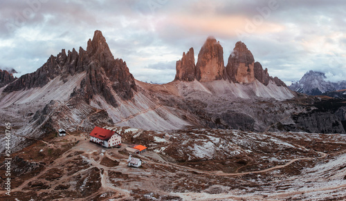 Clouds and mist. Outstanding landscape of the majestic Seceda dolomite mountains at daytime. Panoramic photo
