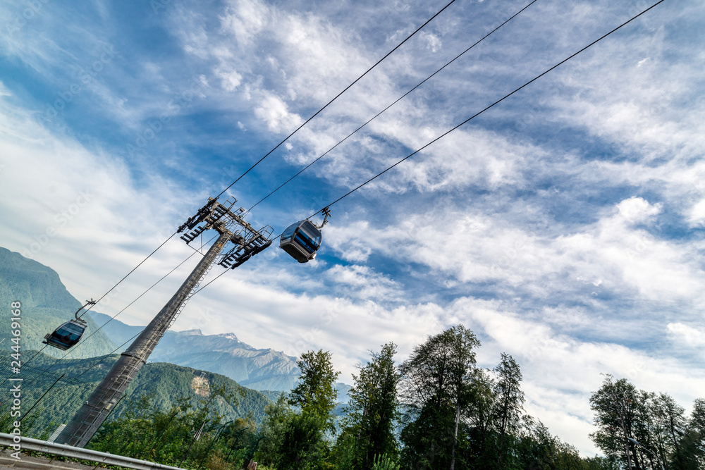 Mountain cableway. Sunny summer day. Mountain cableway. Sunny summer day.