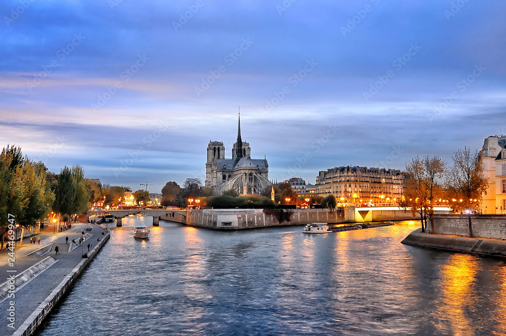 Cathedrale Notre Dame along the banks of the river Seine, Paris, France seen from  pont de latournelle