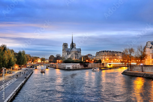 Cathedrale Notre Dame along the banks of the river Seine, Paris, France seen from pont de latournelle