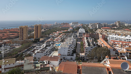 Elevated views of Los Cristianos and Las Americas from Montana Chayofita, popular for shopping, entertainment venues, eateries and restaurants, accessible beaches, in Tenerife, Canary Islands, Spain