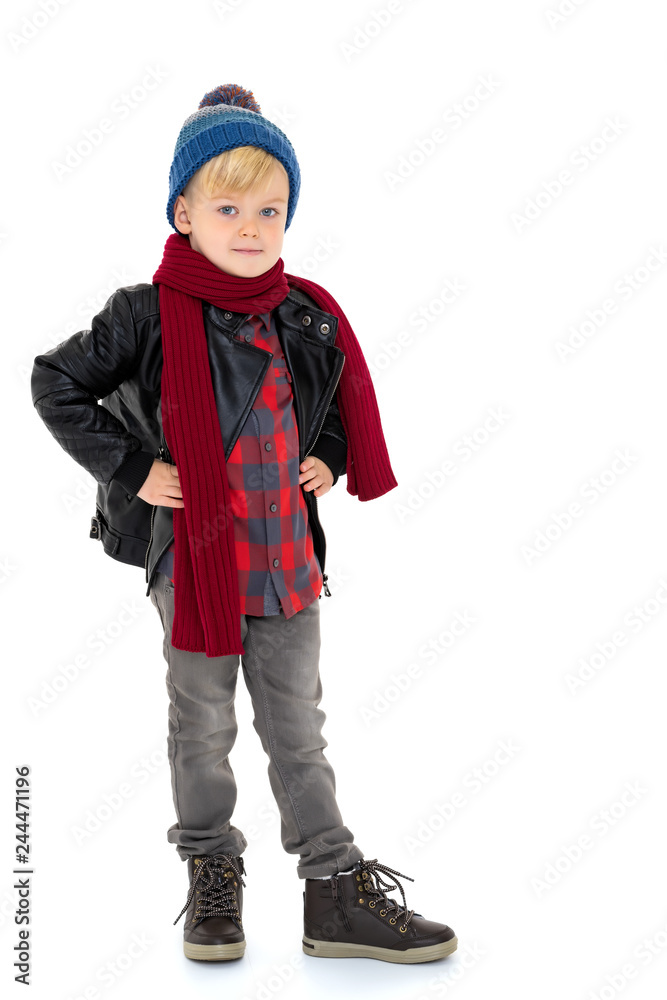 Little boy in a hat and scarf.