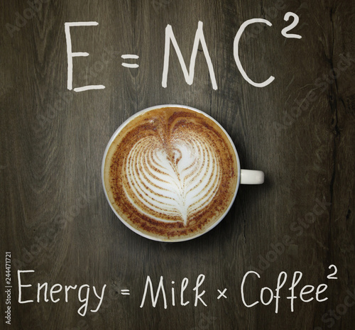 Canvas Print The cup of black coffee with milk and two funny formulas