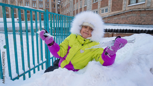 Little girl with icicles in her hands