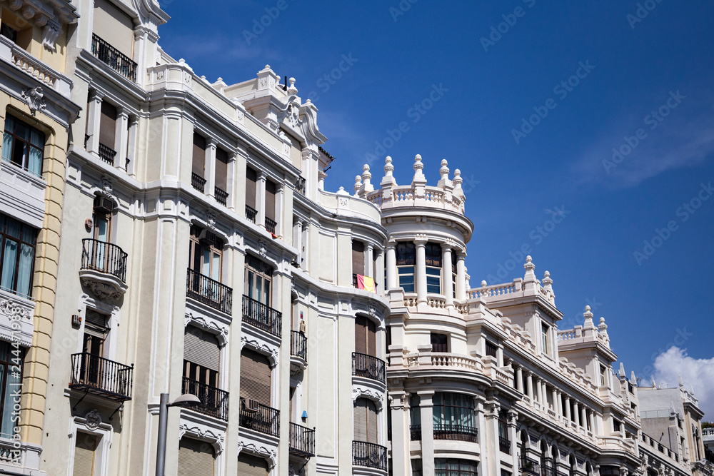 Beautiful classic traditional european architecture on the streets of the famous capital of Spain - Madrid .