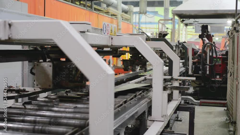 Roller forming machine. The interior of the plant producing a metal profile. Roller forming machine. The interior of the plant producing a metal profile.