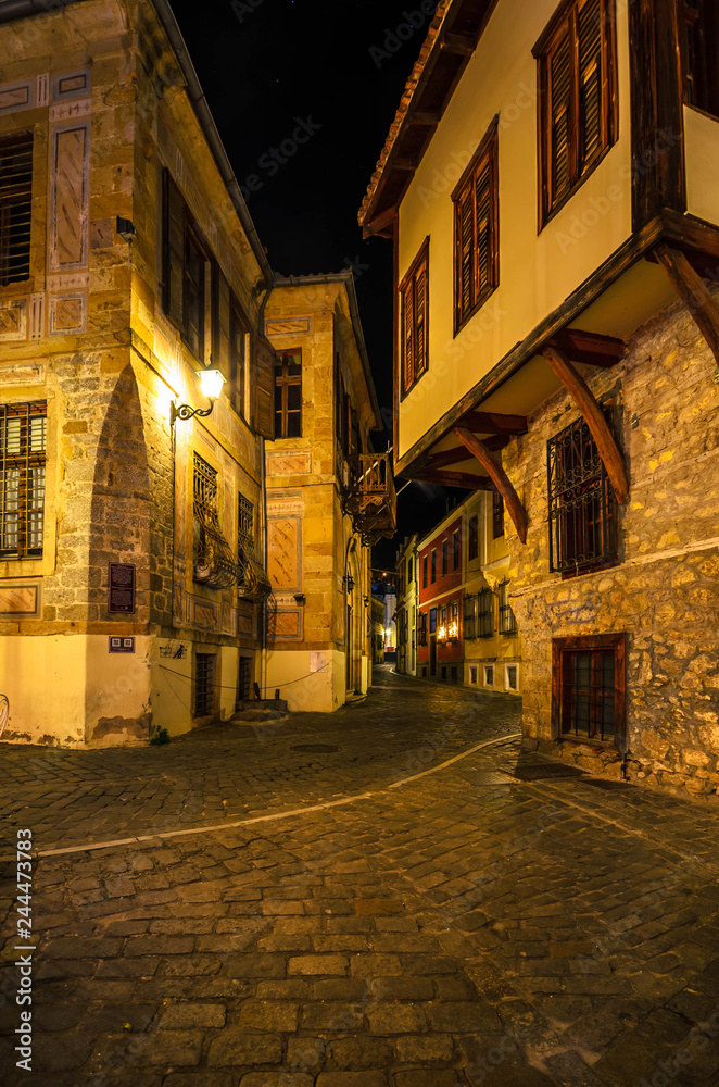 Picturesque narrow alley and neoclassical buildings at night, characteristics in the  old town of Xanthi.
