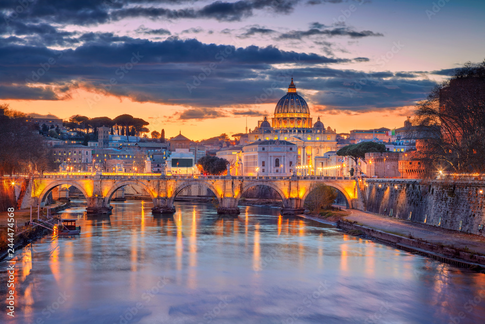 Cityscape image of Rome and Vatican City with the Saint Peter Basilica during beautiful sunset.
