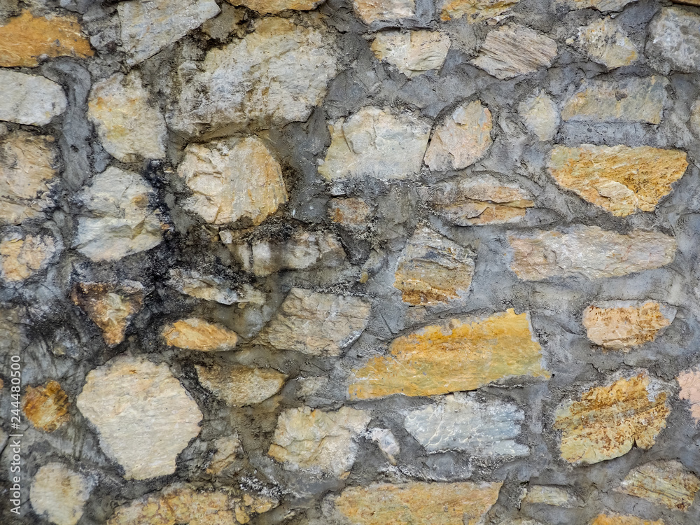 Seamless texture brown stone wall. Seamless background.