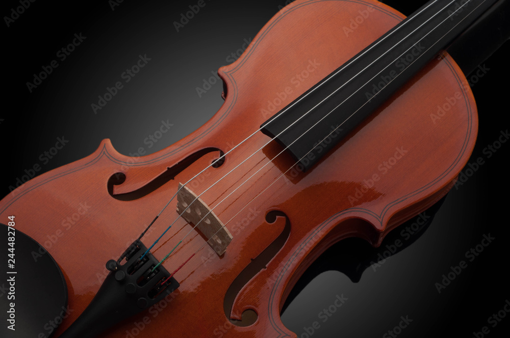 Violin musical instruments of orchestra closeup on black Violin musical instruments of orchestra closeup on black