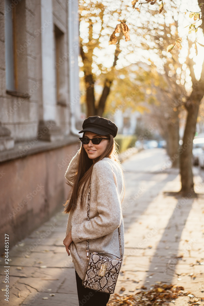Street portrait of young beautiful fashionable woman