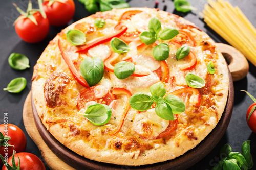 Tasty vegetarian pizza on dark background