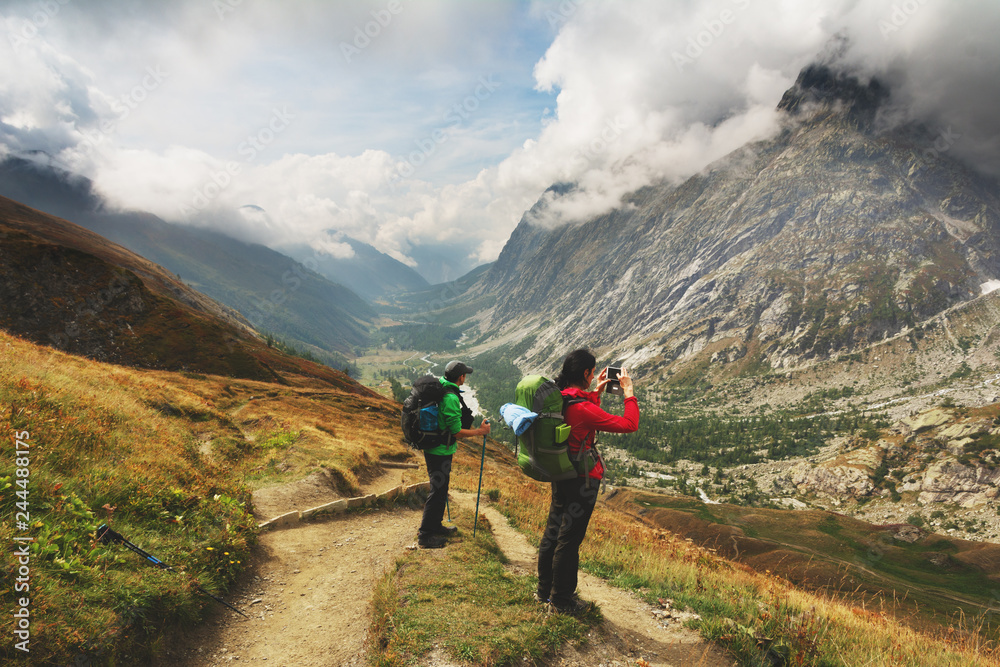 A hiking trip with a backpack of alpine mountains.