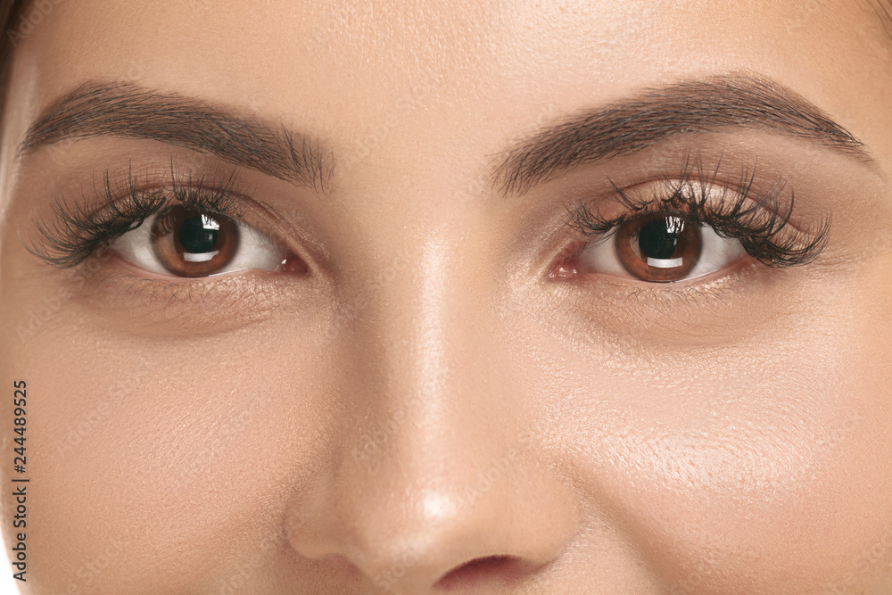 Naklejka premium The beautiful female face. The perfect and clean skin of face on white. The beauty, care, skin, treatment, health, spa, cosmetic concept