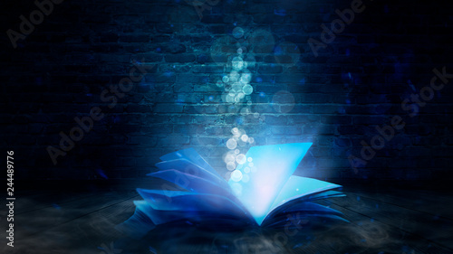 The magic book in a dark room, old brick walls, fantasy, magic dust, smoke. Abstract fantasy background with book.