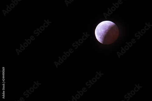 The polar arctic full red super moon eclipse sky star in Norway Svalbard in Longyearbyen city mountains