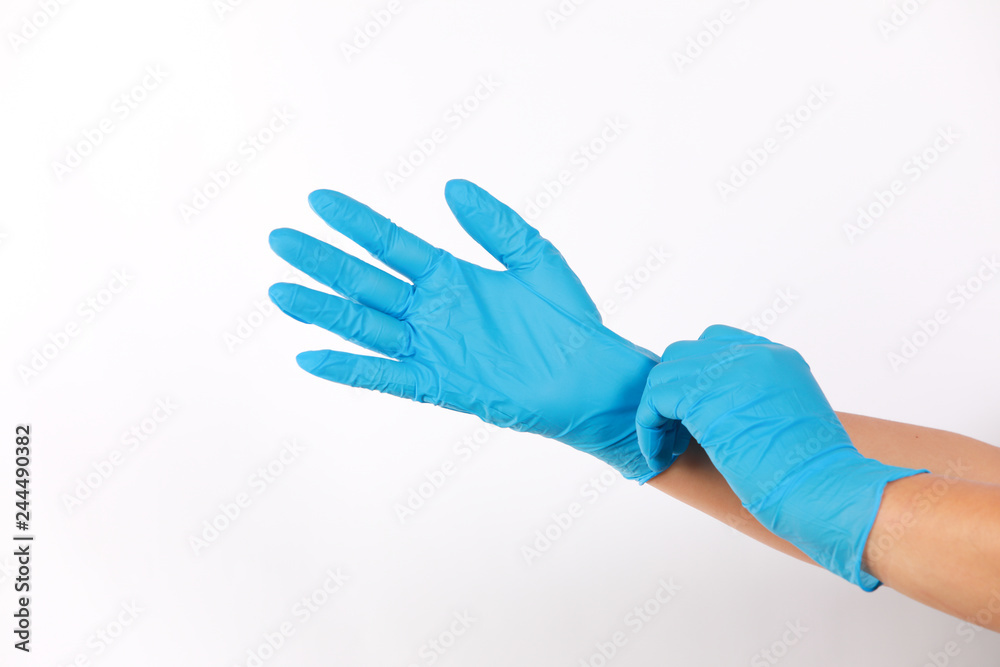 Human wearing glove on white background.	