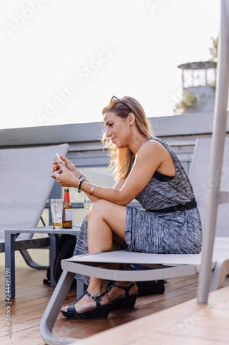Young woman using her phone © OSORIOartist