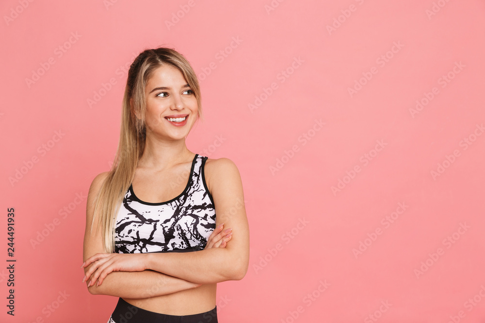 Happy young girl wearing sports clothing standing Happy young girl wearing sports clothing standing