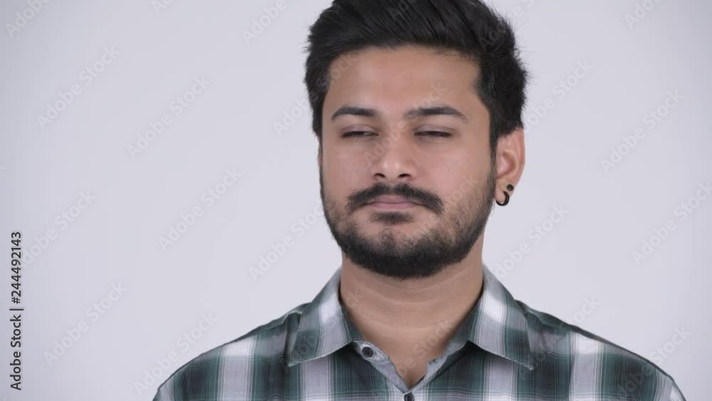 Portrait of young handsome bearded Indian man Portrait of young handsome bearded Indian man