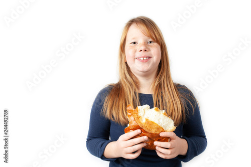 Fat girl eats sweet loaf and laughs. Obesity  overeating.