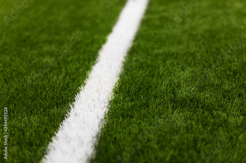 Close-up of artificial turf of soccer pitch. Soccer football field detail
