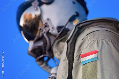 Air force pilot flight suit uniform with Luxembourg flag patch. Military jet aircraft pilot 